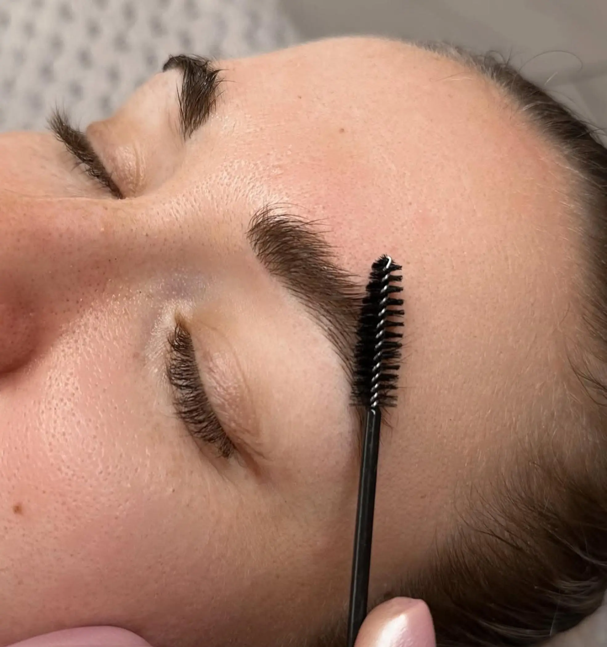 close up fine hair strokes eyebrow tattoo
