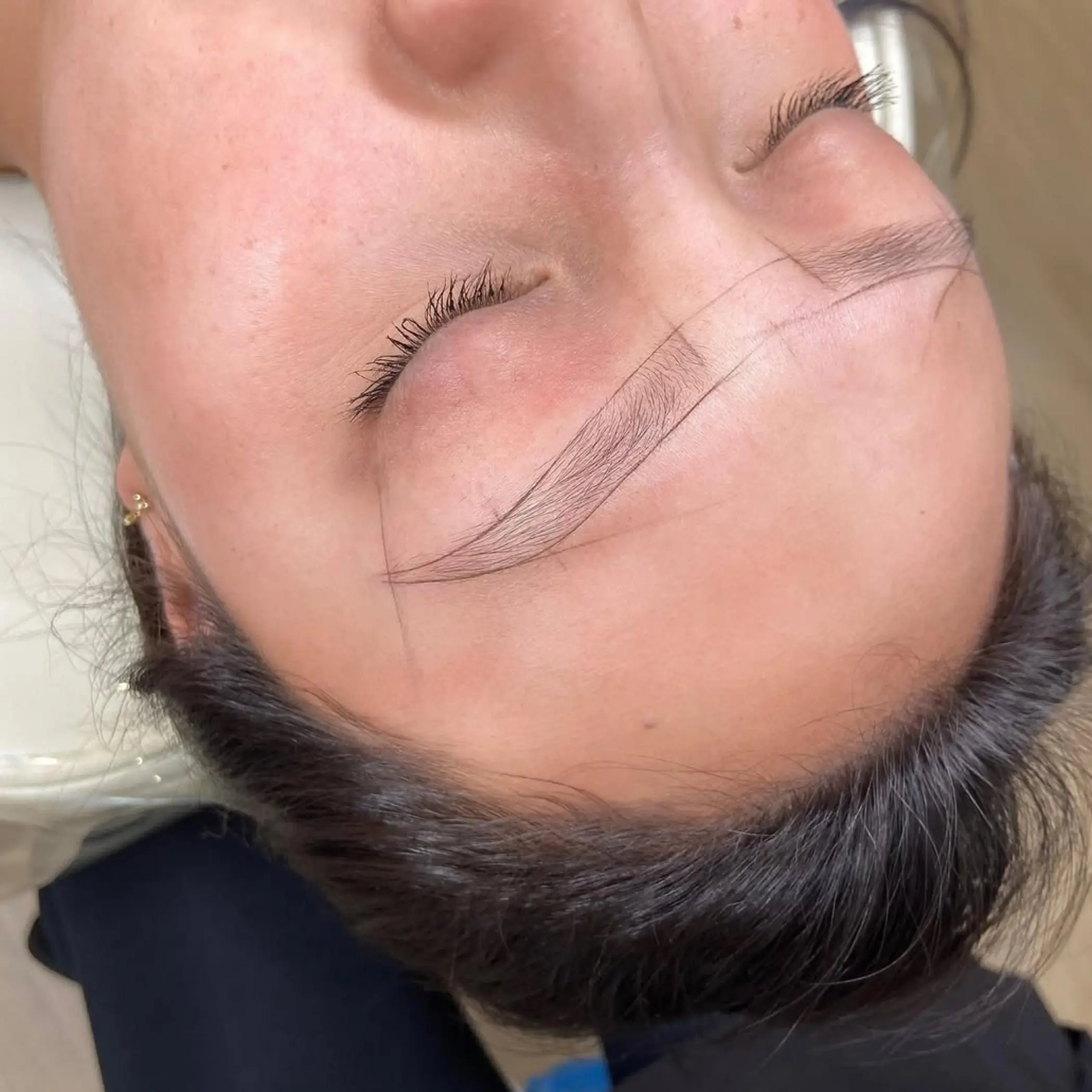 eyebrow tattoo procedure in progress