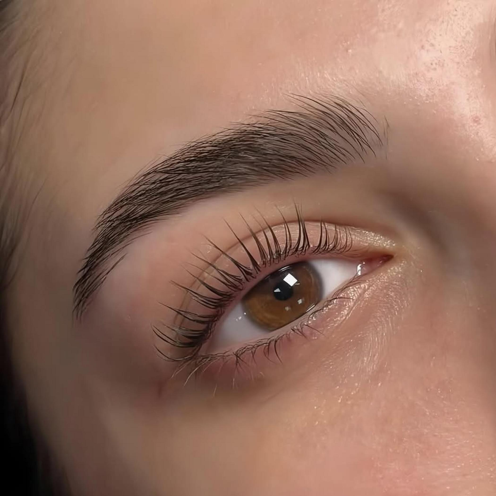 hybrid brow tattoo procedure in progress