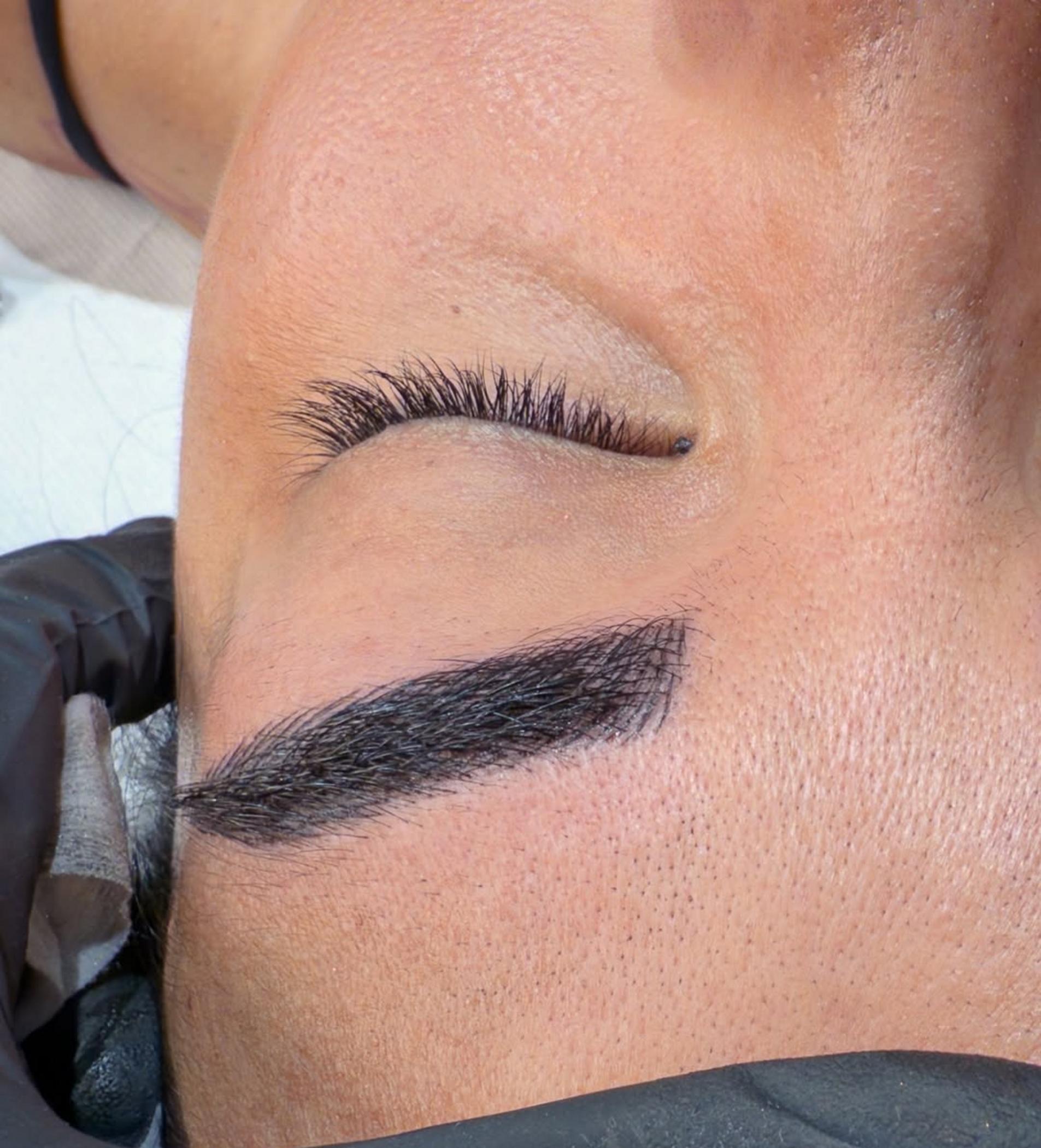 technician applying brow pigment