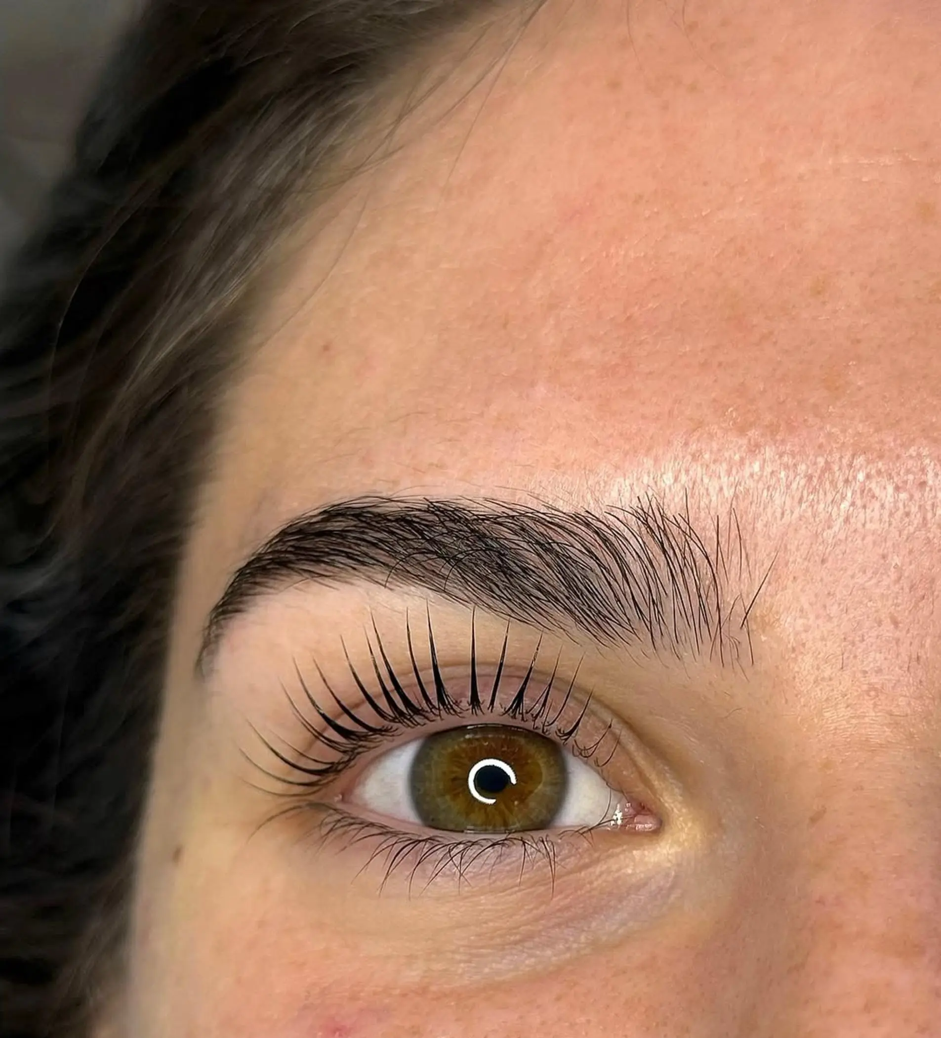 technician applying nano hairstroke brows