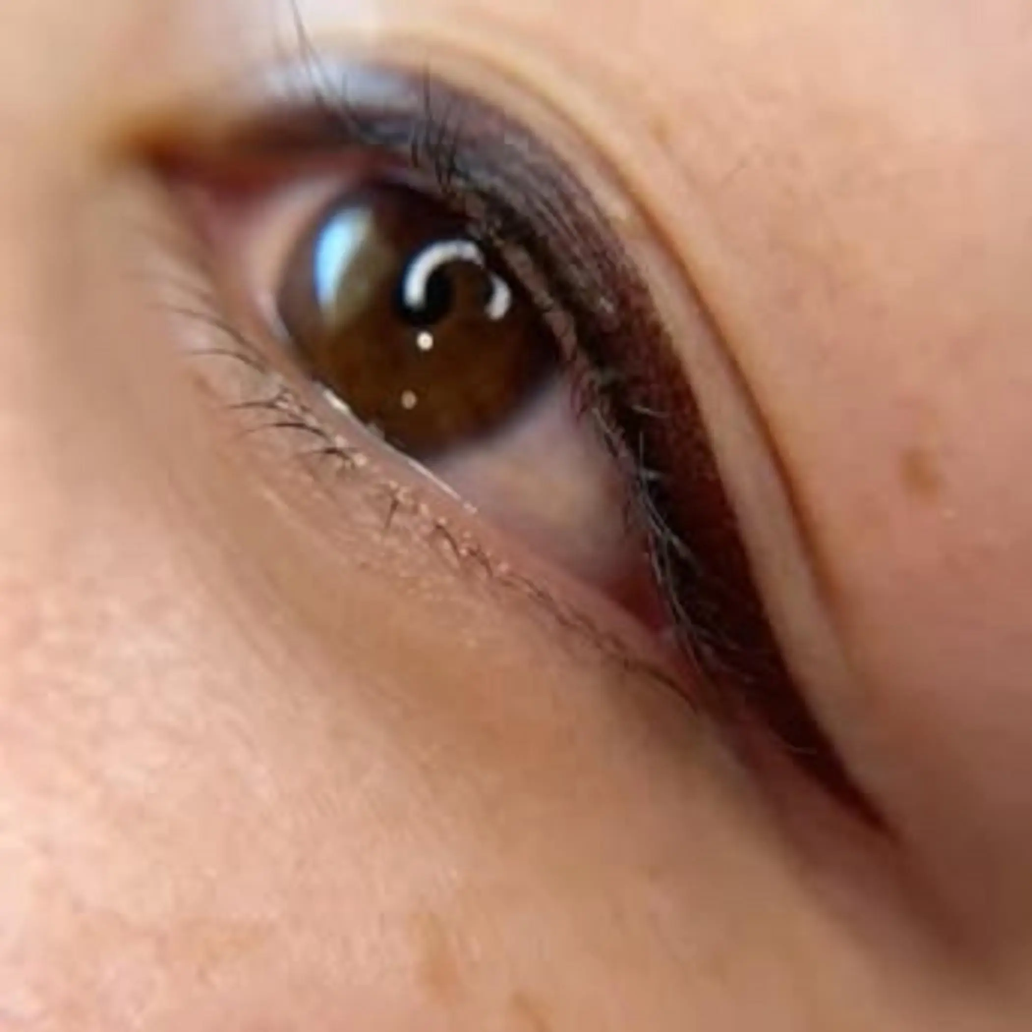 technician performing brow microblading procedure